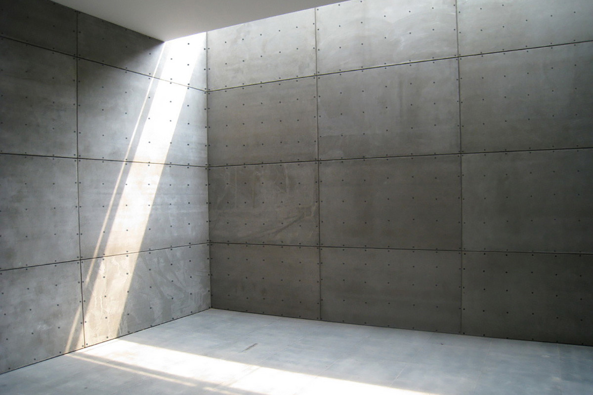 muro aparente de concreto con panel de fibrocemento viva board